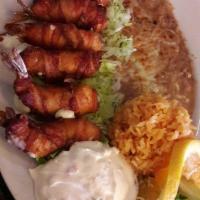 Camarones Costa Azul · Shrimp, imitation crab, cheese wrapped in bacon. Comes with tortillas, rice, beans and your ...
