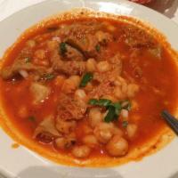 Menudo · Beef tripe soup with a red chili pepper base. 