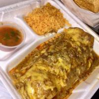 Giant Burrito · Large flour tortilla filled with taco meat and refried beans, covered with gravy and cheese....