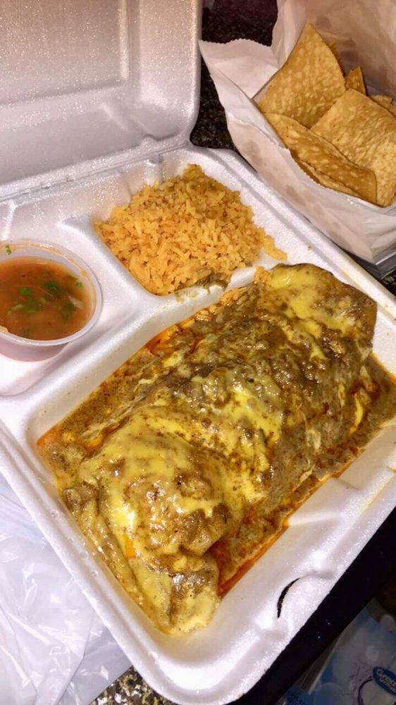 Giant Burrito · Large flour tortilla filled with taco meat and refried beans, covered with gravy and cheese. Served with rice.