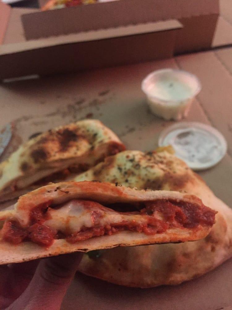 Calzone · Our fresh pizza crust filled with our homemade pizza sauce, spices, heaping mozzarella cheese, and choice of two pizza toppings. Extra toppings for an additional charge.
