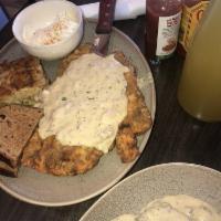 Chicken Fried Steak · Classic hand breaded and fried steak with sausage gravy, eggs, hash browns, and toast.