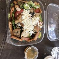 Greek Salad · Romaine lettuce, tomatoes, cucumber, red onions, Kalamata olives, feta, and homemade dressing.