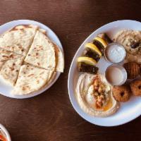 Combo Appetizer · Hummus, baba ganouj, dolmas, and falafel.