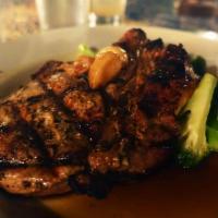 Grilled Pork Chop · Served with Sauteed Broccoli and Gravy