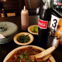 Order of Birria · Goat meat, roasted and served with a special home made family recipe tomato based broth (con...