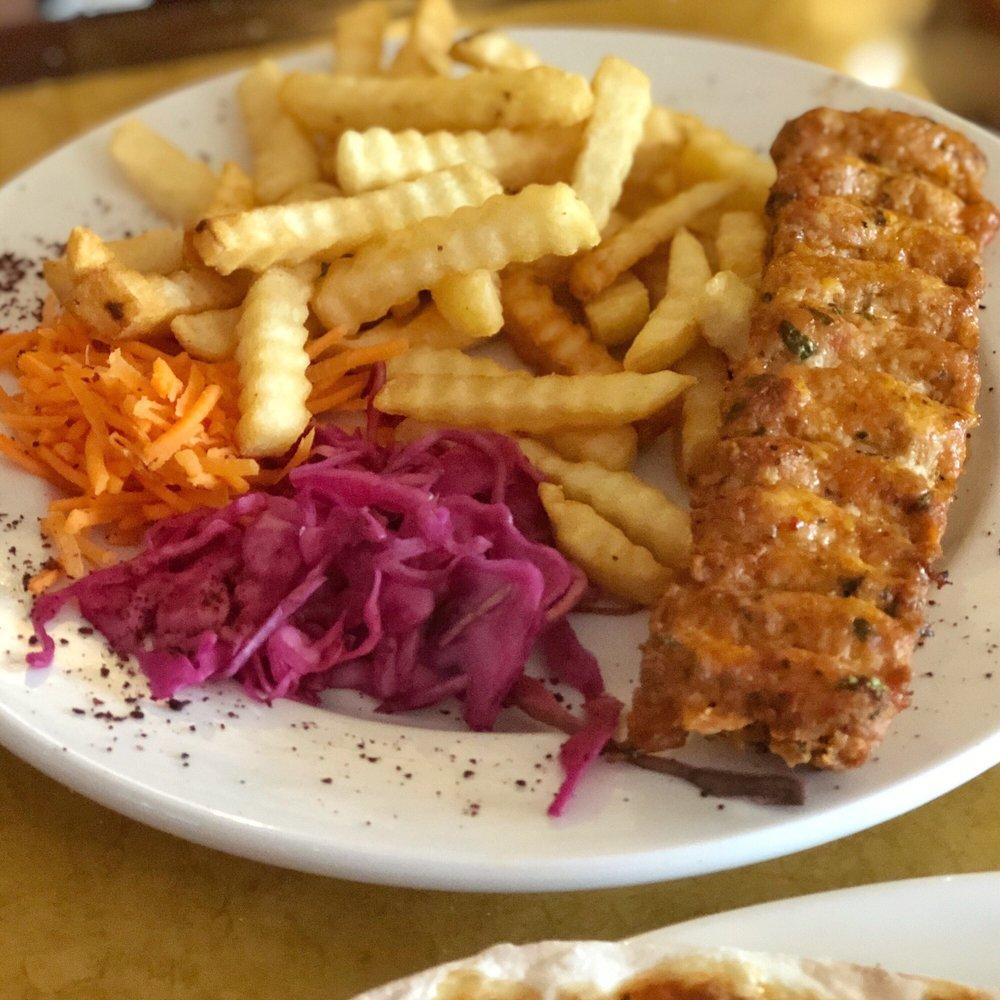 Adana Kebab · Ground lamb blends with a special seasoning mix created by the chef. Entrées are served with pickled red cabbage, carrot salad, white rice and bulgur, bread, and sauces.