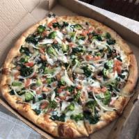 White Veggie Pizza · Broccoli, spinach, tomatoes, mushrooms and onions.