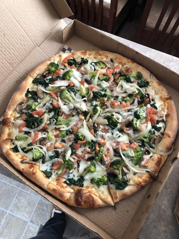 White Veggie Pizza · Broccoli, spinach, tomatoes, mushrooms and onions.