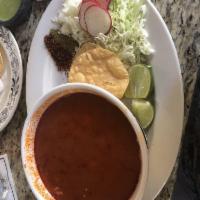 Pozole · Chile guajillo broth with hominy (blanched corn kernels), spices and shredded chicken. Serve...