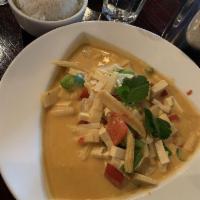 Red Curry · Hot. Coconut red curry stewed with bamboo shoots, onions, mushrooms, baby corn and bell pepp...