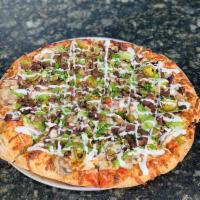 La Mexicana Pizza · Red sauce, cheese, carne asada, red onions, jalapenos, green bell peppers and mushrooms. Spi...