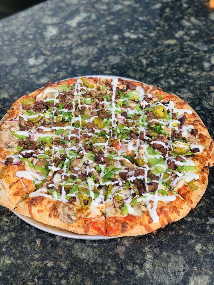 La Mexicana Pizza · Red sauce, cheese, carne asada, red onions, jalapenos, green bell peppers and mushrooms. Spicy.
