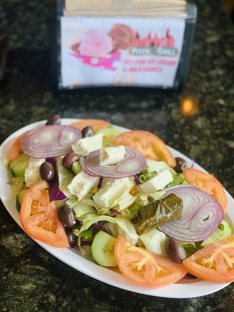 Greek Salad · Fresh lettuce, tomatoes, cucumbers, red onions, black olives and feta cheese tossed with our house dressing. Add chicken for an additional charge. Vegetarian.