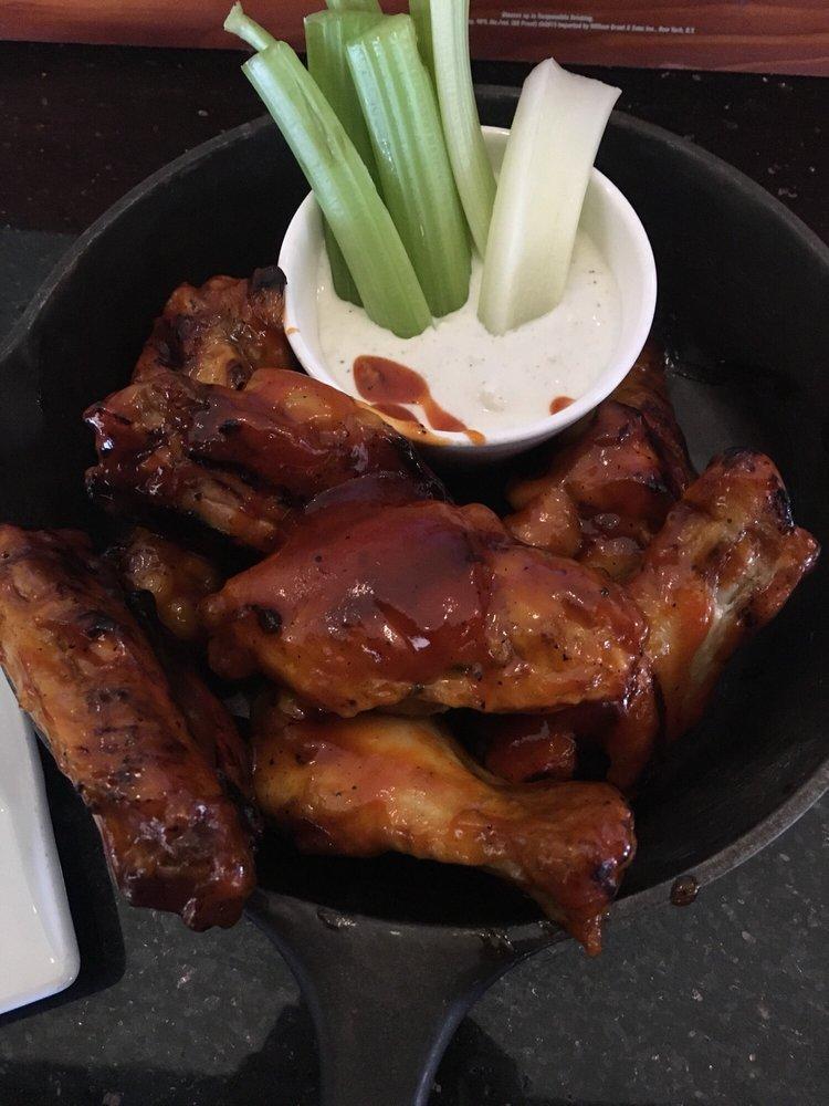 Smoked Wings · House specialty. Applewood smoked, char-grilled, tossed in choice of hot honey or bourbon Buffalo sauce. Gluten free.