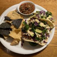 Crispy Fish Tacos · Panko-crusted filleted white fish, fresh avocado, shaved cabbage, ranchito sauce and fresh c...