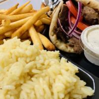 Gyros Plate · Thinly sliced blend of beef and lamb cooked on a vertical rotisserie. Served with pita, rice...