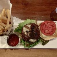 Buffalo Stomp · Bison Burger, Wrapped In Bacon. Grilled Onion, Gorgonzola Blue Cheese, Tomato & Remoulade