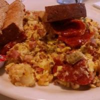Meat Lover's Frittata · 4 eggs, ham, bacon, pepperoni, sausage, home fries and choice of cheese with toast.