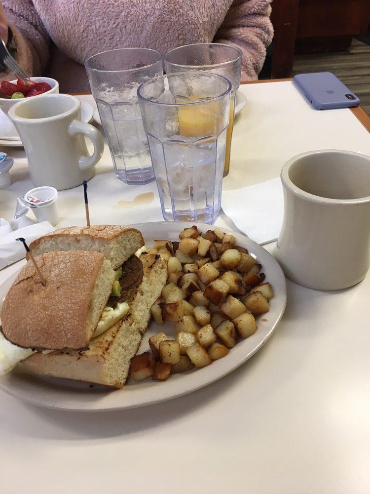 Baja Ciabatta Sandwich · 2 eggs, fried hard or white only, turkey sausage, cheddar cheese and sliced avocado with home fries