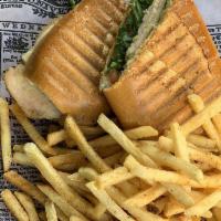 Chicken Pesto Panini · Grilled chicken breast, fresh tomatoes, organic arugula, red onions, pressed in a french rol...