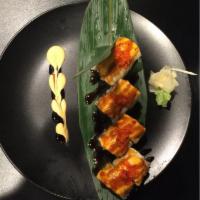 Stoughton Maki · Eel tempura with cucumber topped with layers of torched white tuna, spicy mayo, eel sauce an...