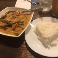 Panang Curry · Panang curry paste with coconut milk, green beans, bell peppers, carrots, and basil.