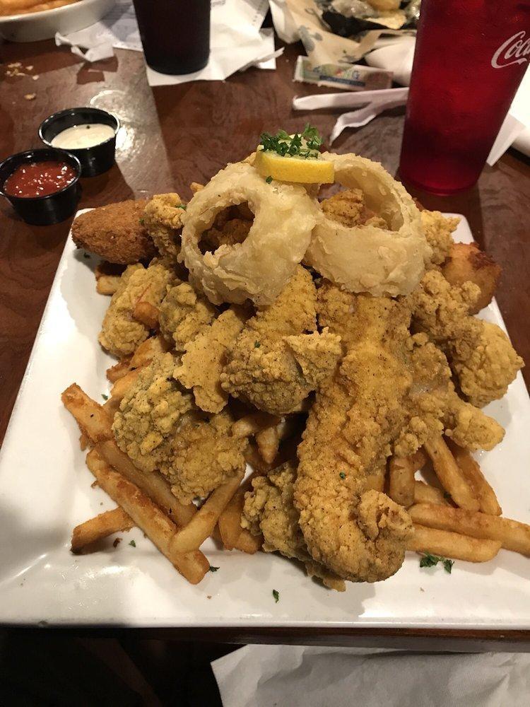 Seafood Platter · Fried shrimp, oysters, fish, crabcake, hush puppies, onion rings and French bread.
