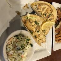 Shrimp or Fish Tacos · Two Fried or Grilled Shrimp or Fish Tacos.  Served with Cajun tartar sauce, pico de gallo an...