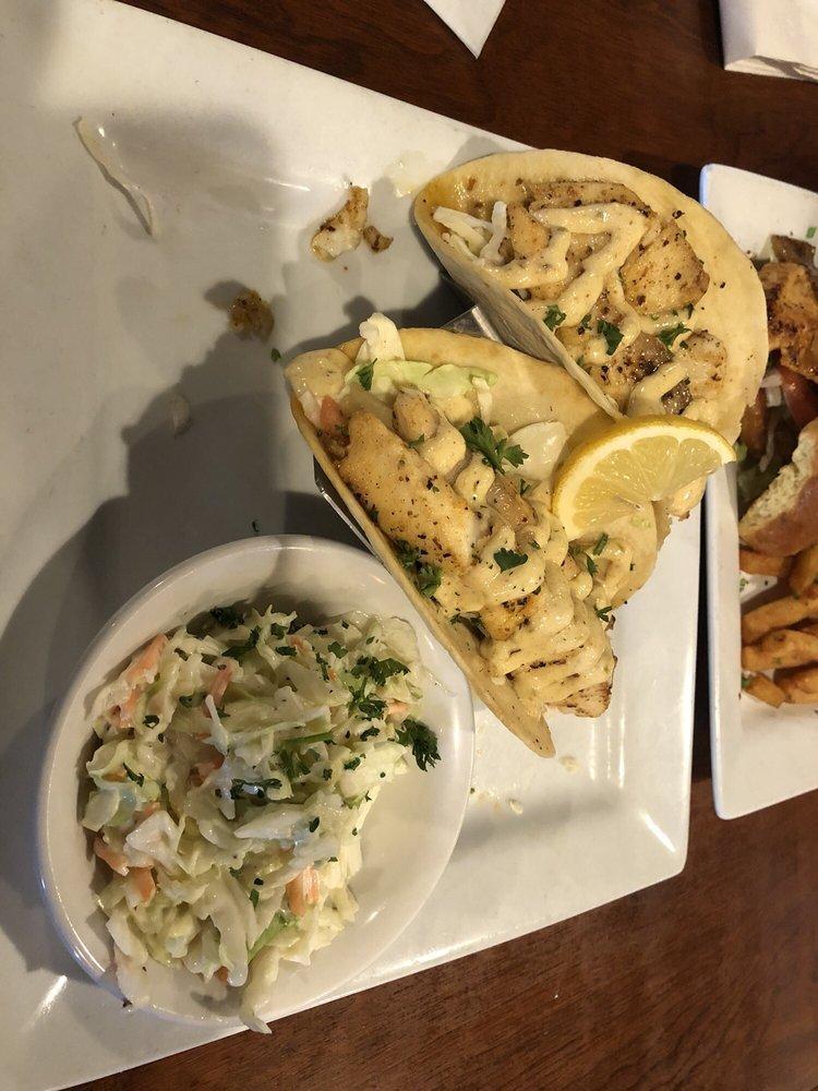 Shrimp or Fish Tacos · Two Fried or Grilled Shrimp or Fish Tacos.  Served with Cajun tartar sauce, pico de gallo and shredded cabbage.