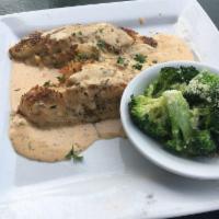 Stuffed Catfish · Two catfish filets stuffed with a crabcake, pan seared and topped with Cajun cream. Served w...