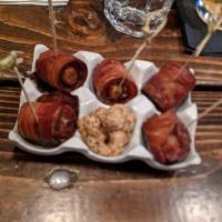 Devils on Horseback · Bleu cheese stuffed dates wrapped in Nueske's bacon with wholegrain mustard. 5 Per order.