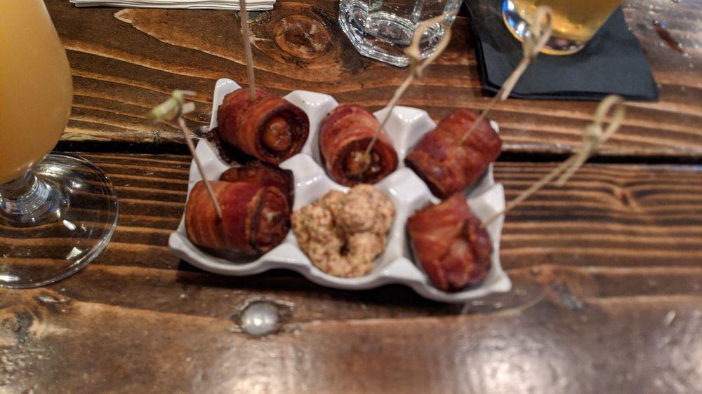Devils on Horseback · Bleu cheese stuffed dates wrapped in Nueske's bacon with wholegrain mustard. 5 Per order.