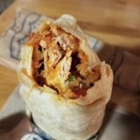 Chipotle Chicken Burrito · Shredded chicken breast marinated with chipotle peppers, Spanish rice, black beans, Jack che...