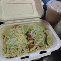 Baja Style Fish Tacos · Two pieces. Beer battered haddock, pico de gallo, Cotija, cabbage slaw, and avocado crema.