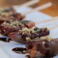 Prosciutto - Wrapped Dates · Goat cheese, pecans, blood orange balsamic and meyer lemon olive oil.