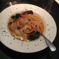 Seafood Pasta · Bay shrimp, tiger shrimp and clams mussels tossed with white wine, garlic, fresh herbs and a...