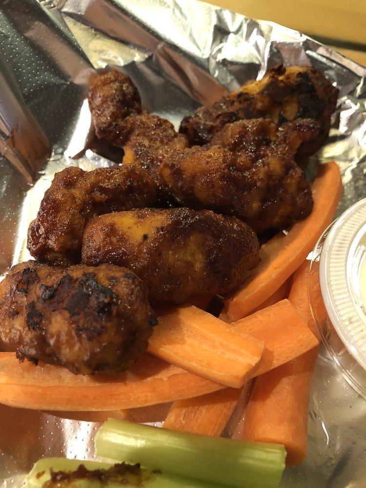 Boneless Wings · Choice of spicy Buffalo, hot Thai, sweet BBQ or original. Served with ranch, blue cheese or sesame oriental dipping sauce and carrots and celery sticks.