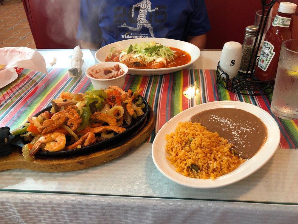 Chicken Fajitas · Fresh grilled strips of chicken, or shrimp cooked with onions, tomatoes, and green peppers - served with Mexican rice, and beans with side of pico de gallo, and guacamole and Mexican sour cream.