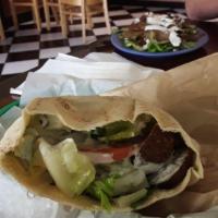Falafel Sandwich · Garbanzo beans mixed with fresh vegetables and spices served in pita bread with shredded let...