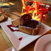 Stuffed French Toast · 2 thick brioche slices stuffed with orange scented mascarpone and berry compote.