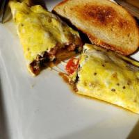 Pepper Bacon Sausage Omelette · Pepper bacon sausage, baby spinach, mozzarella, pepper and onions served with toast.