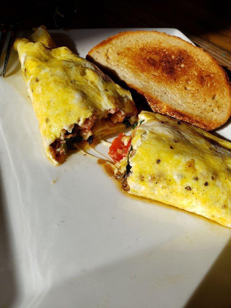 Pepper Bacon Sausage Omelette · Pepper bacon sausage, baby spinach, mozzarella, pepper and onions served with toast.