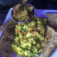 Tofu Scramble · Scrambled tofu with spinach. Sauteed mushrooms, onions, peppers with a side of skillet potat...