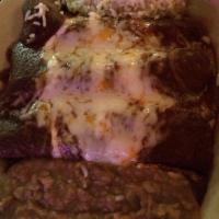 Mole Enchiladas · Traditional mole prepared with dried peppers, nuts, spices, and a touch of unsweetened choco...