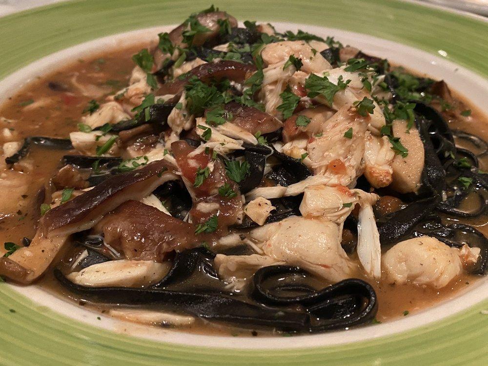 Black Squid Ink Fettuccine Pasta · Served with Jumbo Lump Crab meat, mixed mushrooms shiitake and porcine in a delicious withe wine sauce