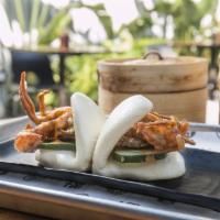 Soft Shell Crab Bao · One whole crispy soft shell crab stuffed in two steamed bao buns with fresh cucumbers, sprin...
