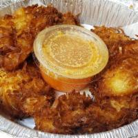 Coconut Shrimp · Fresh crispy fried shrimp rolled in coconut flakes and served with house sauce.