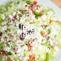 Greek Salad · Topped with feta cheese and Greek olives served on a garden salad.