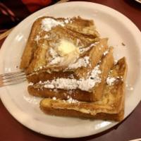 French Toast · 3 sides of thick bread, served with butter and hot syrup.